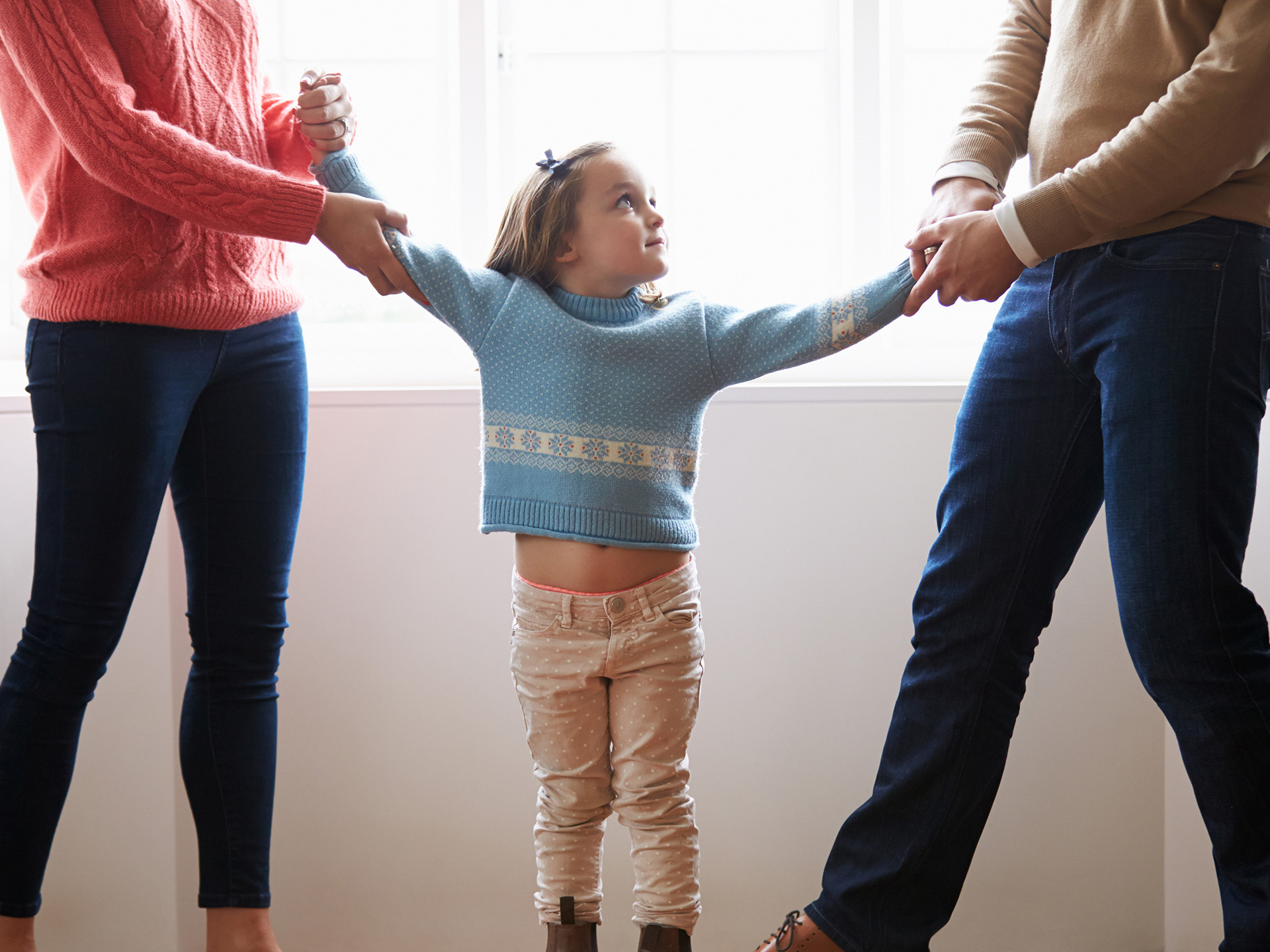 Two Parents Fighting Over Child In Divorce Concept Two Parents Fighting Over Child In Divorce Concept